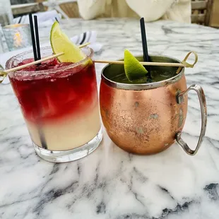 two cocktails on a marble table