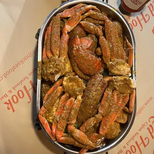 crab legs in a pan