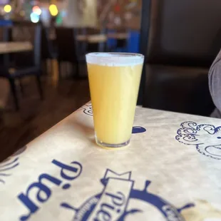 a glass of beer on a table