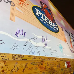 a wall with a lot of writing on it