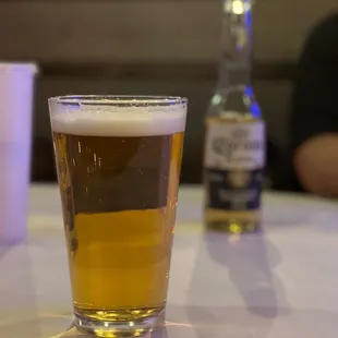 a glass of beer on a table