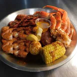 crab legs, corn on the cob, corn on the cob, and