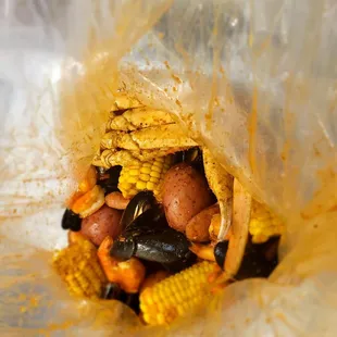 corn, potatoes, mussel, and shrimp