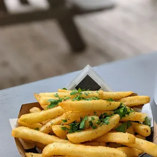 a basket of french fries on a table