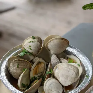 a bowl of clams on a table