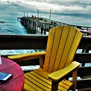 a yellow chair and a red table