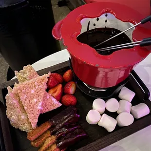 a chocolate fondini pot with marshmallows, strawberries, and strawberries