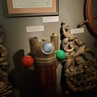 a ship wheel, clock, and other items