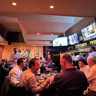 a group of people sitting at a table