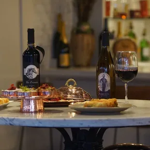  a table with food and wine
