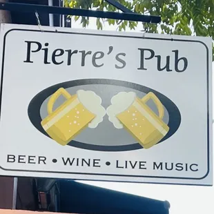 a sign with two glasses of beer