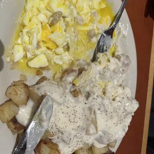 Biscuits and gravy home fries, and eggs