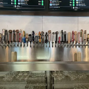 a row of beer taps