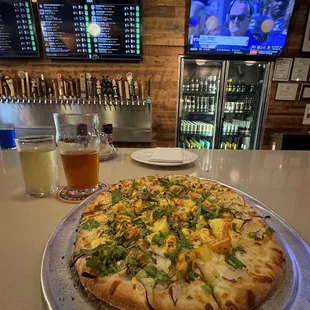 a pizza on a serving platter
