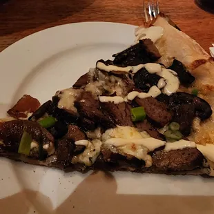 Steak and mushroom drizzled w horseradish.