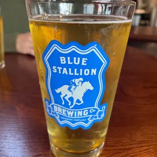 a glass of beer on a table