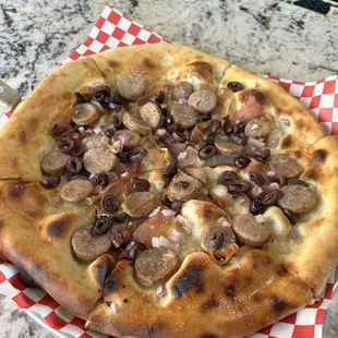 Build Your Own Pizza -It was incredible! Olive oil, no cheese, Kalamata olives, red onion, prosciutto and sausage. I need to get this again!