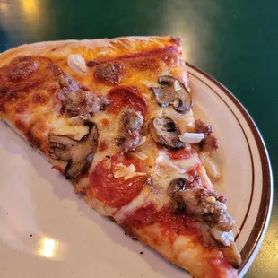 Pizza slice Pepperoni, sausage, mushrooms