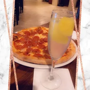 Pepparoni pizza and an adult beverage