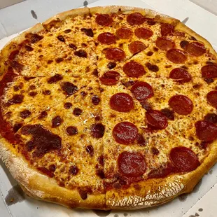 a pepperoni pizza in a box