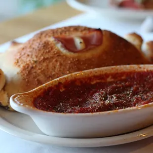 CALZONES - Every CalZano is hand-prepared to order. A garlic infused dough baked with cheese and up to three toppings of your choice.