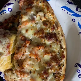 One piece of chicken on this chicken Alfredo slice...