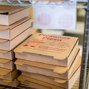 a stack of pizza boxes