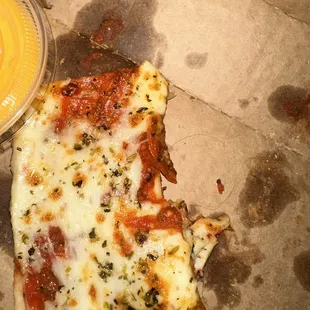 a slice of pizza and a drink