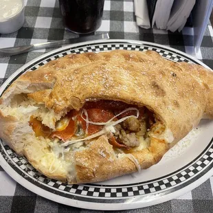My wife had a build your own calzone That consisted of sausage, pepperoni and mushroom