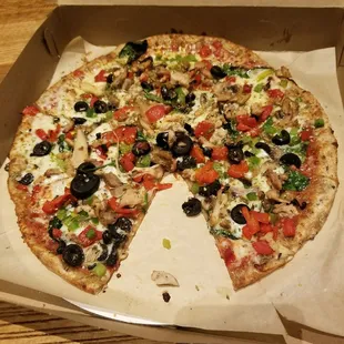Build your own pizza! Lots of veggies, Spinach under the cheese, olives, banana peppers, red peppers, green peppers, mushrooms and chicken!