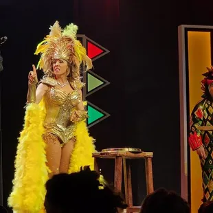 a woman in a costume on stage