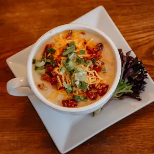 a bowl of soup on a plate