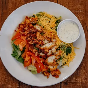 a plate of salad with dressing