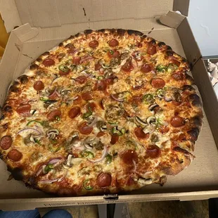 Pepperoni, sausage, jalapeño, and onion pizza
