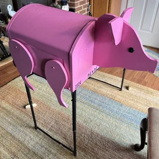 a pink pig shaped mailbox