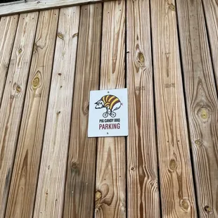 a sign on a wooden fence