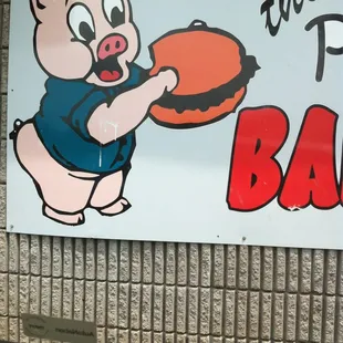 ows a pig holding a pizza