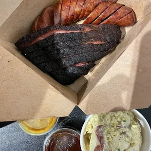 1/2 lb brisket &amp; 1 hot link ($7). Small potato salad