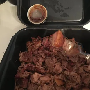 pork in a black container