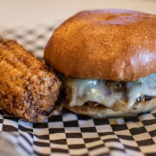 Texas Heat - Pork patty, jalapeno relish, fried onions, and Pepper Jack served with fried sweet corn