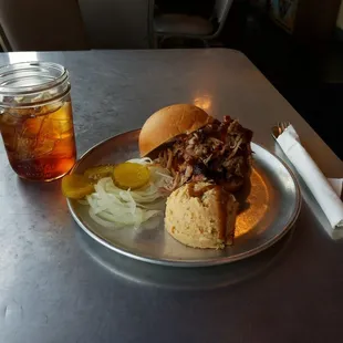 READY to destroy this pulled pork sandwich with a side of mashed potato salad. And always some sweet tea that&apos;s exceptionally good.