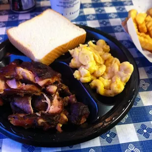 Medium barbecue chicken with mac n&apos; cheese and fries. ($10.65)