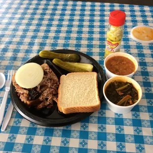 Pulled pork sandwich, Brunswick stew and collard greens. $10 bucks