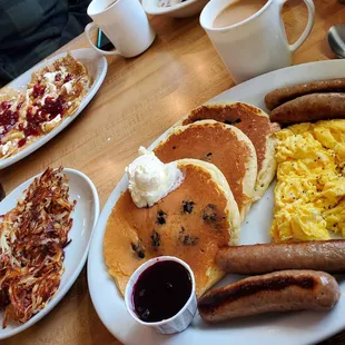 Swedish pancakes and soft scrambled with blueberry pancakes and sausage with side of hash browns!