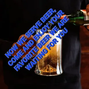 a man pouring beer into a glass