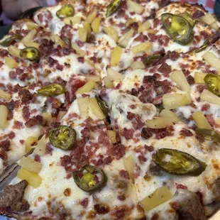 Meat lovers pizza add jalapeño and pineapple