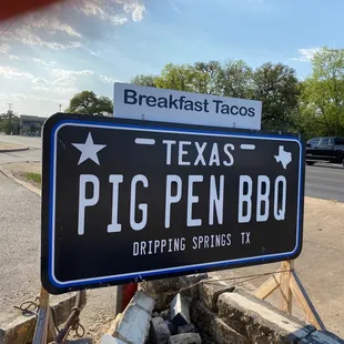 a sign on the side of the road