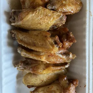 chicken wings in a styrofoam container