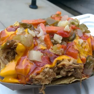 DTE (Down To Eat) Nachos with pulled pork, house made BBQ sauce, nacho cheese and mild giardiniera!