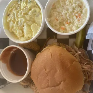 Pulled pork sandwich potato salad coleslaw